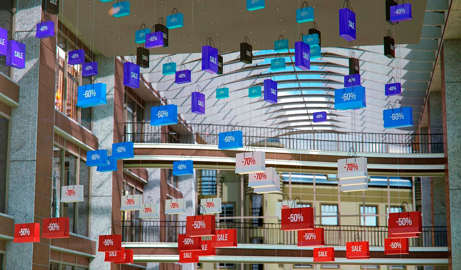 Кинетическая инсталляция Shopping Vortex в атриуме торгового центра — подвешенные разноцветные пакеты с надписями SALE и процентами скидок (-40%, -50%, -60%, -70%) формируют динамичную пространственную композицию под стеклянной крышей.